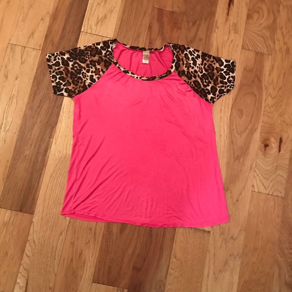 Solid magenta top with leopard short sleeves.